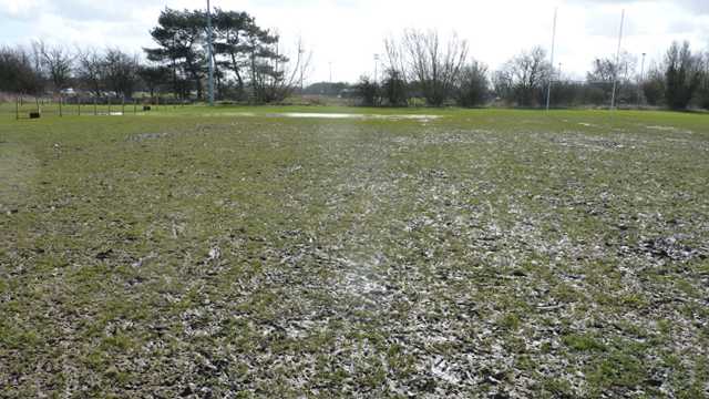 Waterlogged rugby pitch